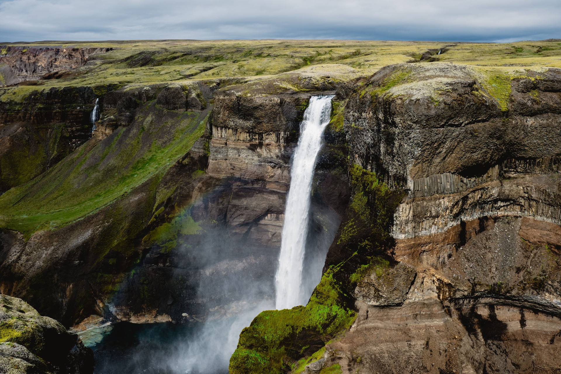 Majestic Haifoss waterfall cascading down cliffs in the stunning landscapes of Iceland