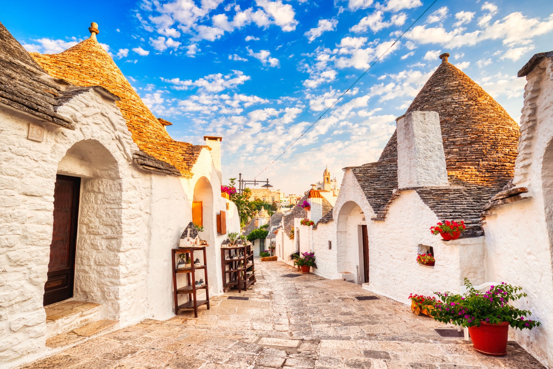Famous Trulli Houses during a Sunny Day with Bright Blue Sky in Alberobello, Puglia, Italy